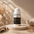 Sharnee's hair extension care product on a wooden surface with decorative elements.