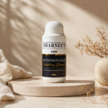Sharnee's extension hair hydrating shampoo bottle on a wooden platform with a neutral background