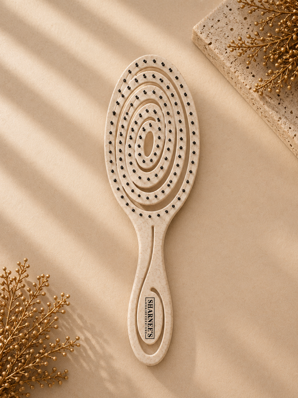 Wooden hairbrush with circular pattern on a beige background