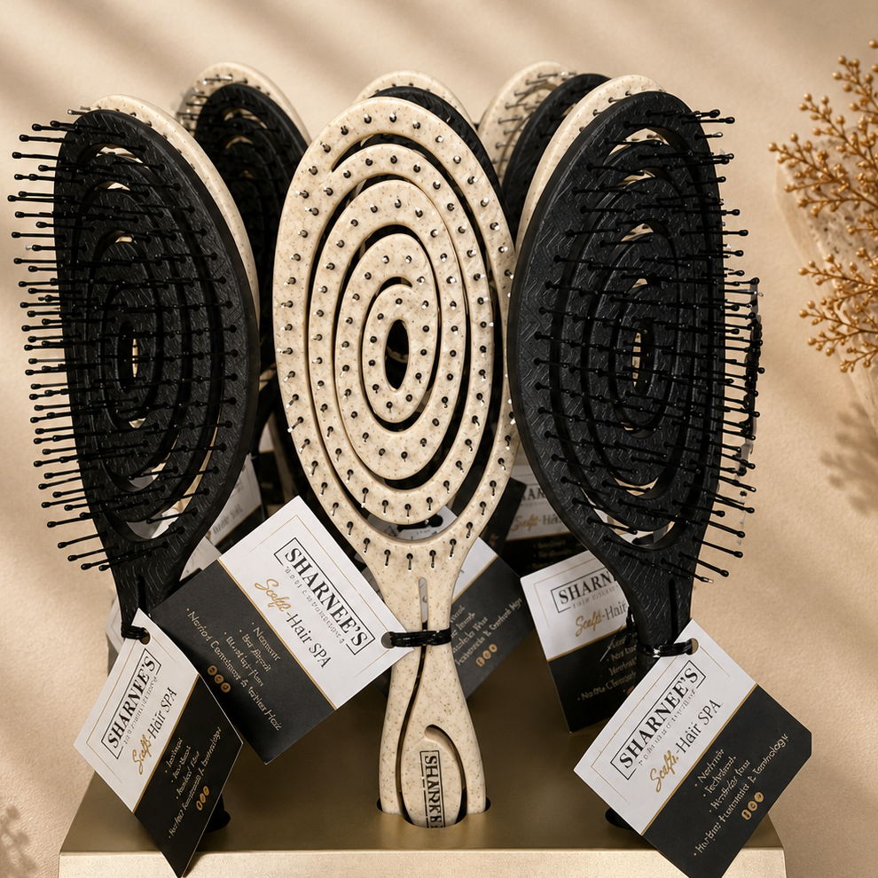 Set of hairbrushes with circular patterns on a beige background